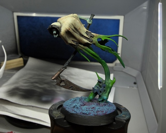 Photo of a Grimghast Reaper painted in the same scheme as the Glaivewraith above. This one has less detail in the green wisps and so lacks contrast there.