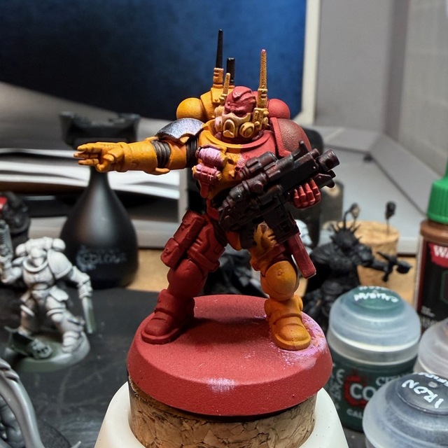 Photo of a part-painted space marine with a fully-red base