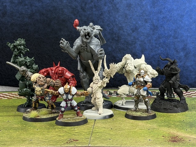 Another line-up photo, this time with a BB-converted Rostus Oxenhammer alongside and the old metal Morg 'n' Thorg, a human lineman and a converted Stormcast lineman in front. The dracoline still towers over them all but feels in the same scale as everything else.