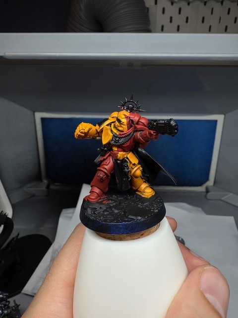 Photo of the same space marine miniature that was red and pink, where the pink quarters are now a rich yellow